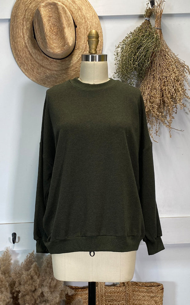Dress form displaying olive oversized sweatshirt