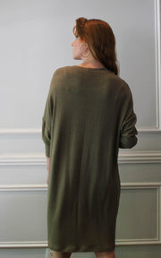Back view of model in oversized dress with hoop earring