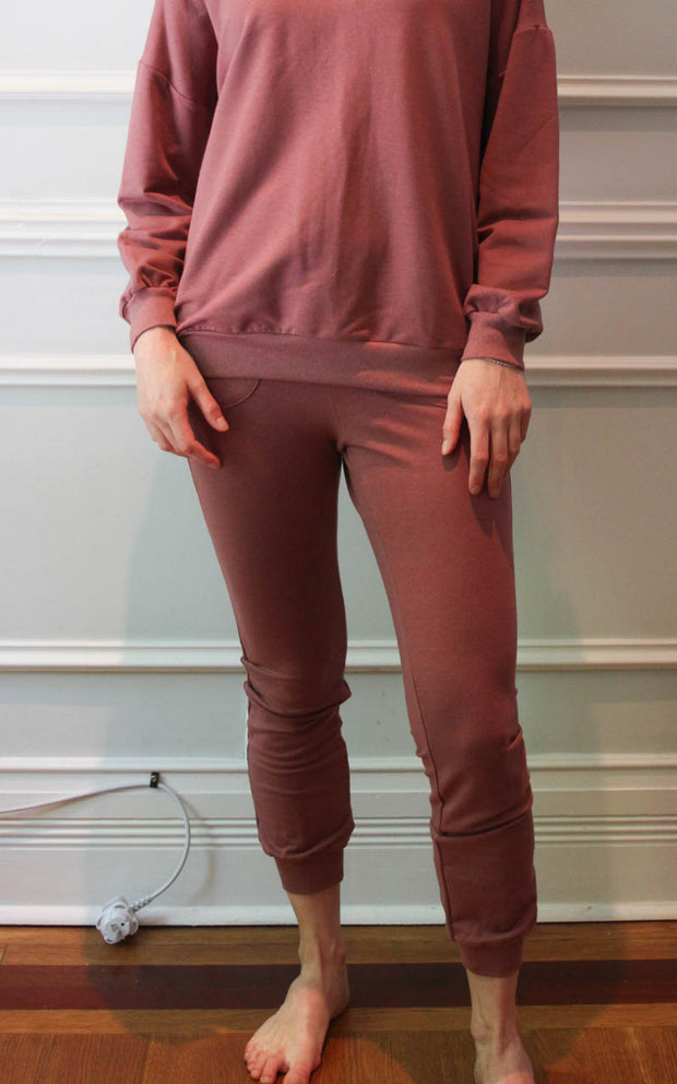 Model wearing joggers with matching oversized sweatshirt